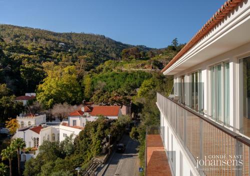 a view from the balcony of a house at Pure Monchique Hotel - Villa Termal Spa Resort - by Unlock Hotels in Monchique
