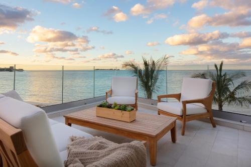 a living room with a view of the ocean at Goldwynn Resort & Residences in Nassau