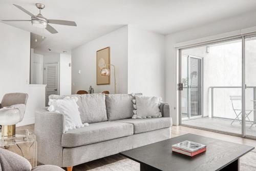 a living room with a couch and a table at Redondo Beach 1BR w Pool Gym WD nr Beach LAX-613 in Redondo Beach