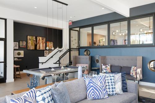 a living room with a couch and a table at Redondo Beach 1BR w Pool Gym WD nr Beach LAX-613 in Redondo Beach