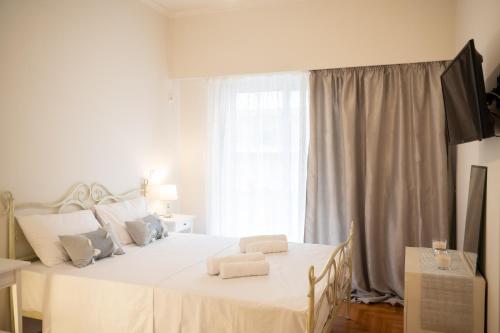 Postel nebo postele na pokoji v ubytování Amalthia Apartment Piraeus
