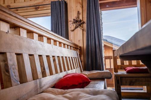 a bedroom with a bed and a large window at Le Dahu - 8-kamer chalet + sauna & bar 14 personen in Landry