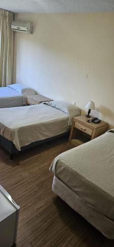 Postel nebo postele na pokoji v ubytování Hotel Klee