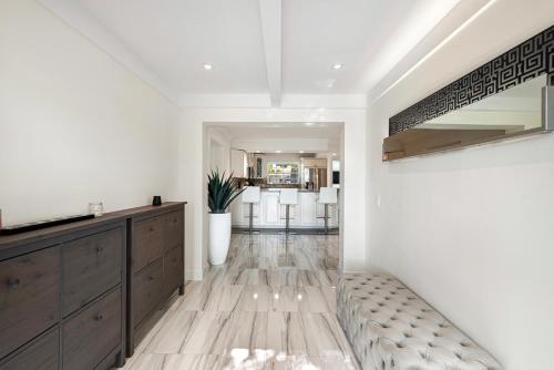 a living room with a couch and a table at Hollywood Beach Exquisite 4-bed 3-bath Villa in Hollywood