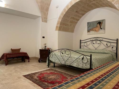 a bedroom with a bed in a room at La stella salentina in Montesano Salentino