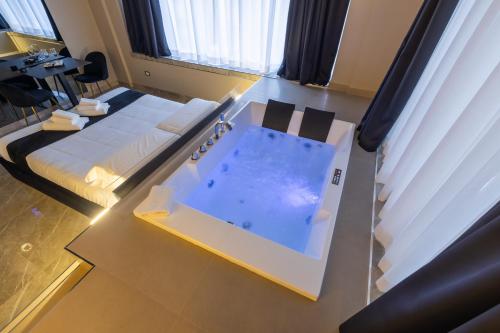 a hospital room with a hot tub in the middle at Maximum Exclusive Suite & Spa in Palermo