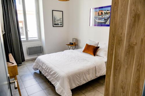 Кровать или кровати в номере Flavia - Central, Balcon, Clim - Ajaccio