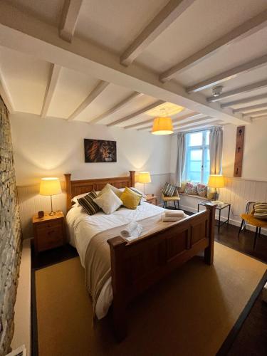 a bedroom with a large bed in a room at The Lion, Tredington in Shipston on Stour