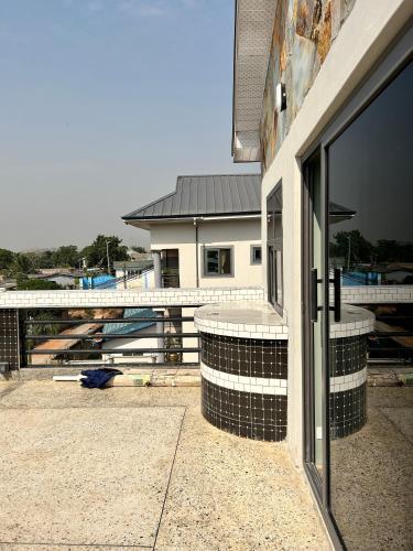 a building is under construction with a large glass door at Queen's Hill Lodge in Oblogo