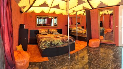 a bedroom with two beds and two mirrors at Semi-detached villa sea views, huge terrace, close beach in Palm-mar