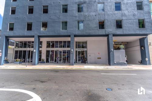 a building on a city street with a building at Downtown Miami Condos by Lua Host in Miami