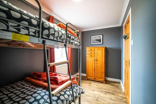 Postel nebo postele na pokoji v ubytování Burnside Cottage
