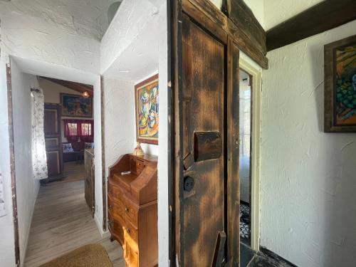 an open door in a room with a hallway at Casa Fidelina II Miraflores de la Sierra in Miraflores de la Sierra