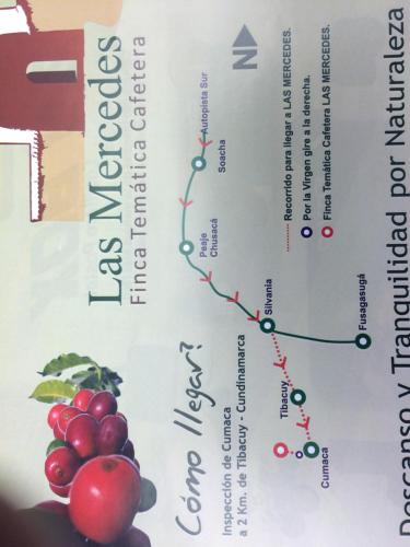 a book with a picture of grapes on it at Las Mercedes Finca Cafetera in Cumaca