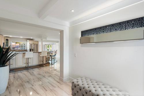 a living room with a couch and a kitchen at Hollywood Beach Exquisite 4-bed 3-bath Villa in Hollywood