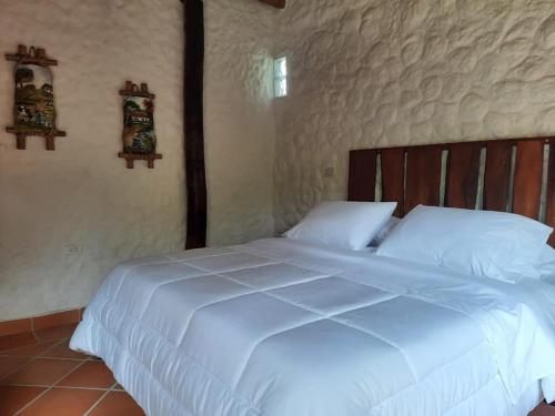 Tempat tidur dalam kamar di Costello Campestre