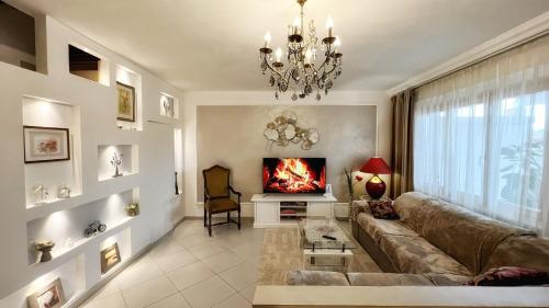 a living room with a couch and a fireplace at Dimora di Luce in Pezze di Greco