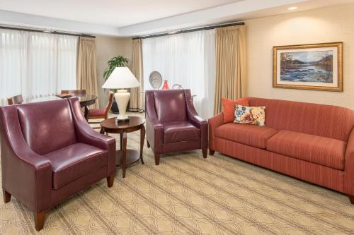 a living room with a couch and chairs and a table at The Inn at Virginia Tech - On Campus in Blacksburg