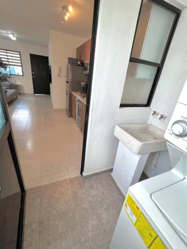 a kitchen with a sink and a counter top at Luxury Apartment with Great Location 2-A in Matamoros