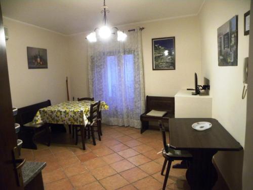 a living room with a table and a dining room at Case Vacanze Albamarina in Lipari