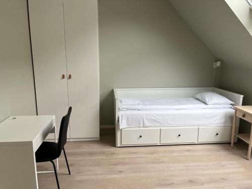Postel nebo postele na pokoji v ubytování Kong Oscars Apartments