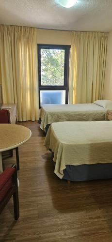 Postel nebo postele na pokoji v ubytování Hotel Klee