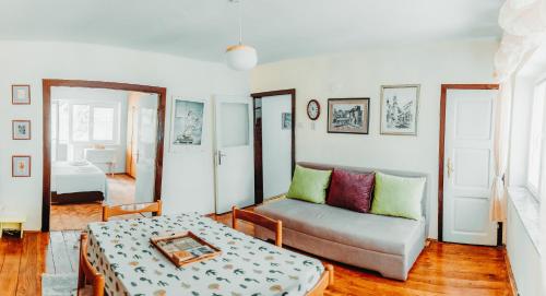 a living room with a couch and a table at Heart City Apartment in Ohrid