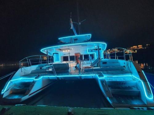 a large boat in the water at night at The Castle Ocean Marina Double Suite in Yeosu