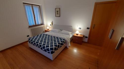 A bed or beds in a room at Appartamento Alessandro