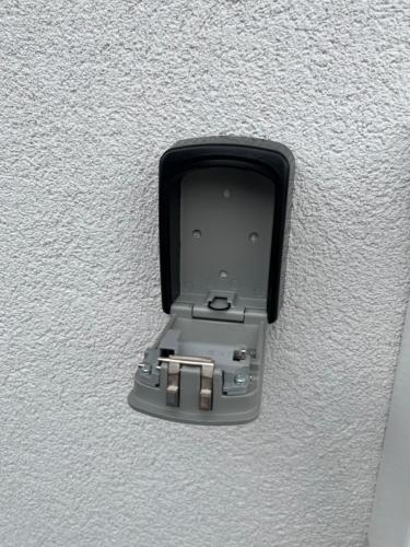 a black electrical outlet on a white wall at Haus Karner in Neusiedl am See