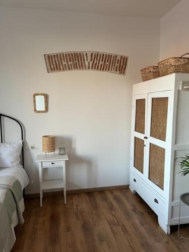 Cama o camas de una habitación en Is Scabas Guestrooms