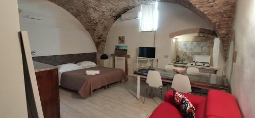 A bed or beds in a room at La Dimora Del Letterario