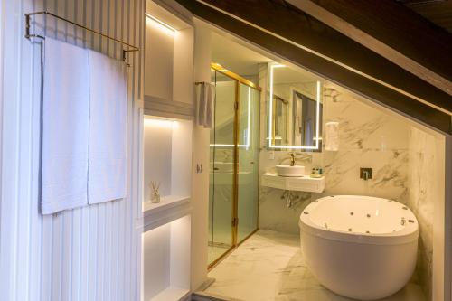 Um banheiro em Hotel Pousada Kaster