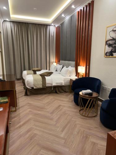 Postel nebo postele na pokoji v ubytování Smayah Hotel