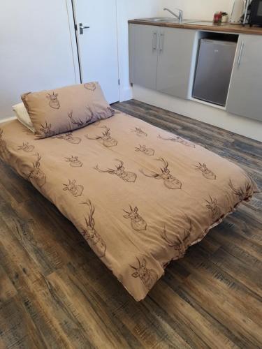 a bed sitting on the floor in a room at 140 Bond in Blackpool