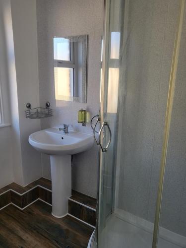 a bathroom with a sink and a shower at 140 Bond in Blackpool