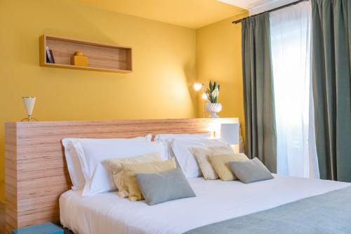 Postel nebo postele na pokoji v ubytování Archè Design Rooms and Suites