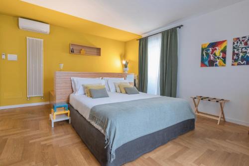 Postel nebo postele na pokoji v ubytování Archè Design Rooms and Suites