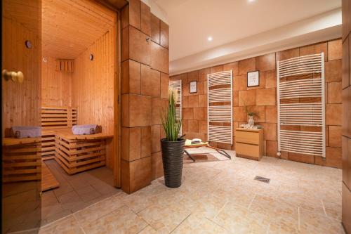 a wine cellar with wooden walls and a plant in a vase at Haus Ferienglück Sauna im Haus in Ostseebad Sellin