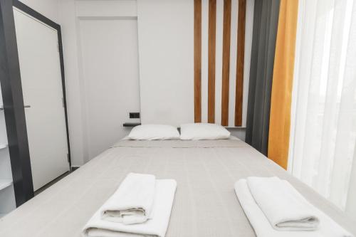 Postel nebo postele na pokoji v ubytování Besa Apartments