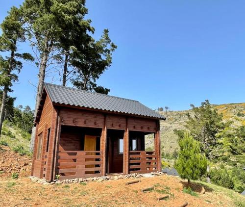 a small wooden cabin on top of a hill at Mountain Eco Shelter 6 in Funchal