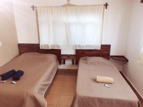 Cama o camas de una habitación en Azomalli