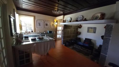 a kitchen with a large island in the middle of a room at Casa do Lobo in Lamego