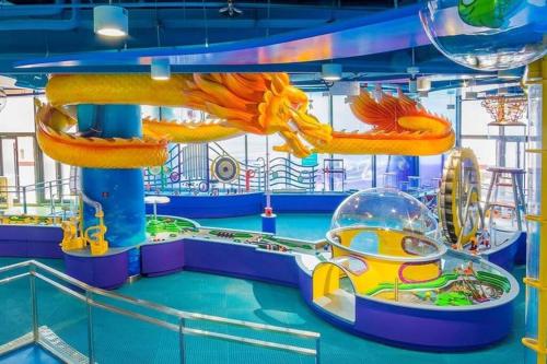 a water park on a cruise ship with a roller coaster at Luxury 8 Bed/4 Ba NuLu Home Private yard/parking in Louisville