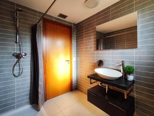 a bathroom with a sink and a shower at Casa con piscina en L'Estartit in Girona