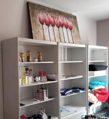 a shelf with some baseball bats on it at Daniele's flat in Venice Mestre in Mestre