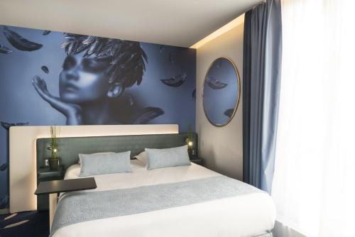 Postel nebo postele na pokoji v ubytování Le Bon Hôtel