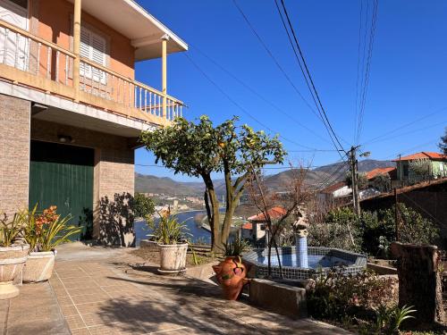 a house with a view of a river in the distance at Casa de Sergude in Peso da Régua