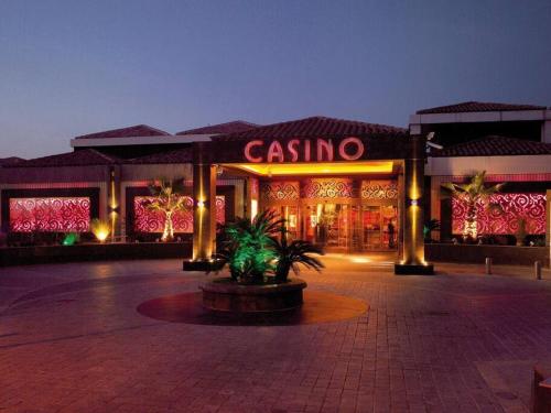 a casino building with a sign in front of it at L' Alto - 80m2, Grand Terrasse avec vue sur le Cap, à 200m des plages in Cassis