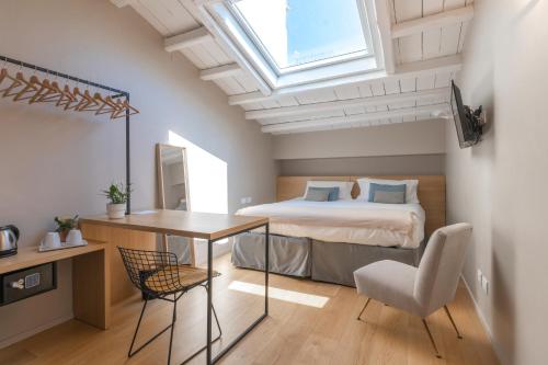 Postel nebo postele na pokoji v ubytování Archè Design Rooms and Suites